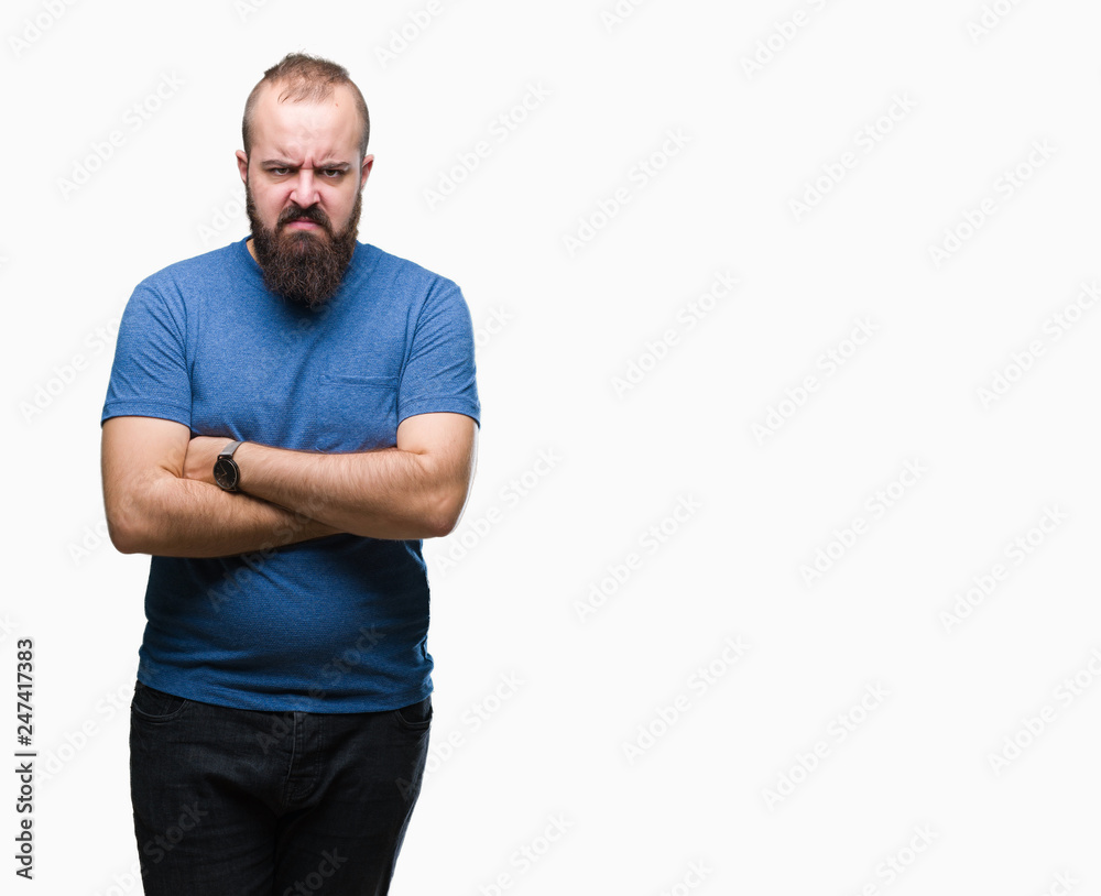 Young caucasian hipster man over isolated background skeptic and nervous, disapproving expression on face with crossed arms. Negative person. Young caucasian hipster man over isolated background skeptic and nervous, disapproving expression on face with crossed arms. Negative person.