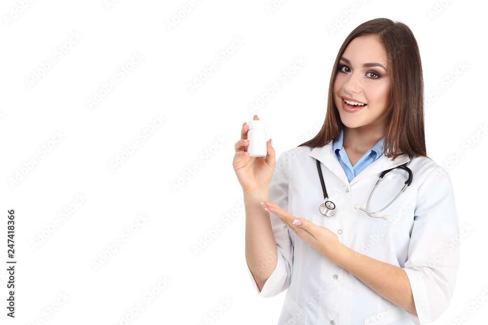 Young doctor holding medicine bottle on white background Young doctor holding medicine bottle on white background