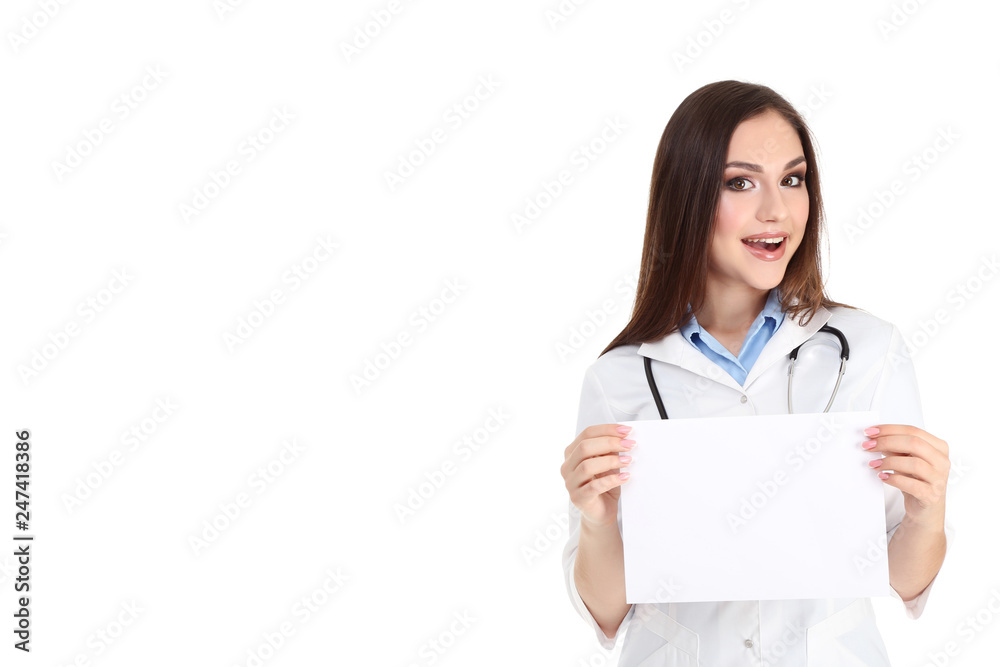 Young doctor holding blank sheet of paper on white background Young doctor holding blank sheet of paper on white background