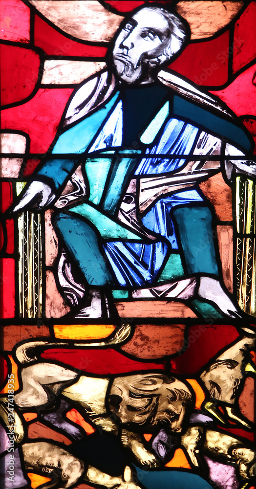 The Prophet Micah with a lion symbol, stained glass window in Basilica of St. Vitus in Ellwangen, Germany 