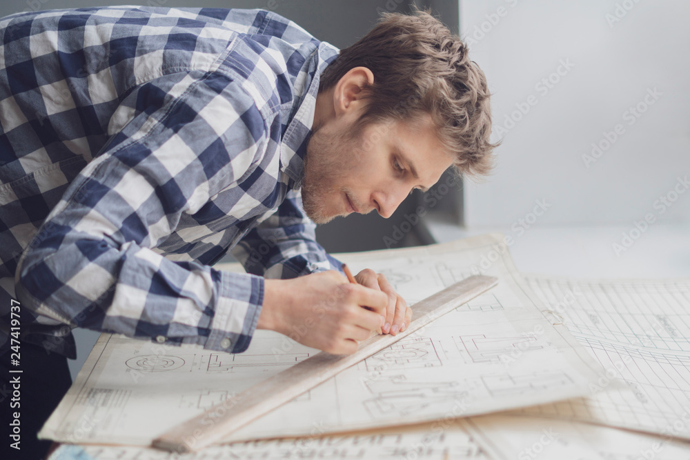 close up person draw schemes with a pencil b close up person draw schemes with a pencil b
