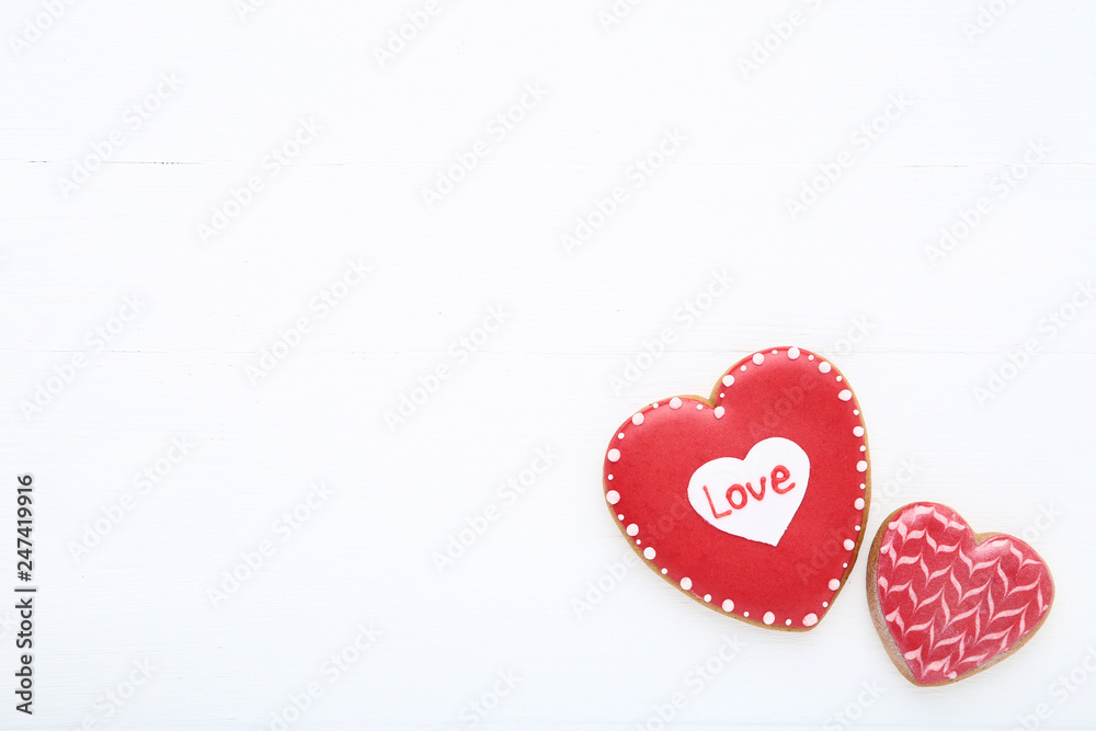 Valentine day heart shaped cookies on white wooden table
