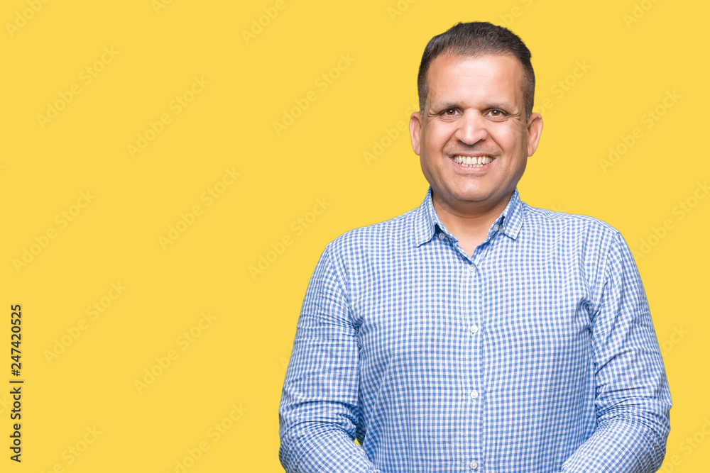 Middle age arab business man over isolated background Hands together and fingers crossed smiling relaxed and cheerful. Success and optimistic Middle age arab business man over isolated background Hands together and fingers crossed smiling relaxed and cheerful. Success and optimistic
