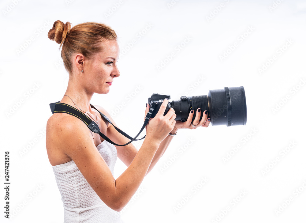 Caucasian white female model portrait. Beautiful girl, long red hair. Woman posing studio shot on a white background Caucasian white female model portrait. Beautiful girl, long red hair. Woman posing studio shot on a white background