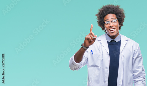Afro american doctor scientist man over isolated background pointing finger up with successful idea. Exited and happy. Number one.