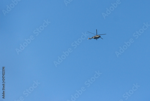 blue sky on which helicopter flies