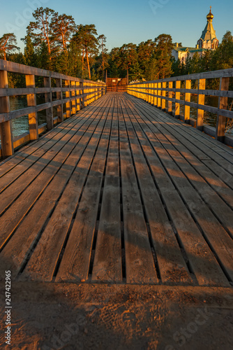 Bridge to the gates of St. Nicholas Skete. The wonderful island Valaam is located on Lake Lodozhskoye, Karelia. Balaam - a step to heaven photo