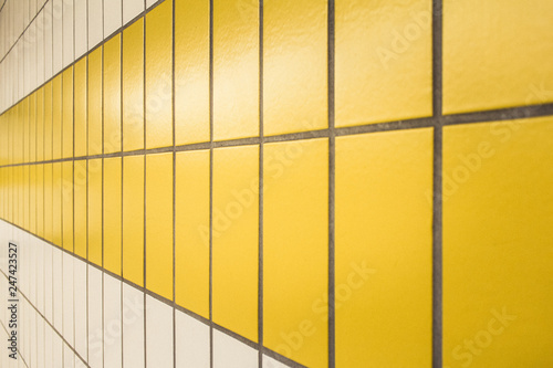 Yellow and white tiles in a subway station in Düsseldorf, Germany