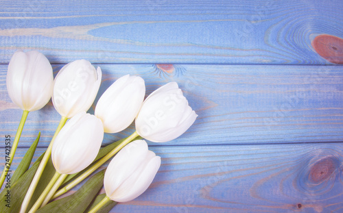 A bouquet of white tulips with a frame for inscription.