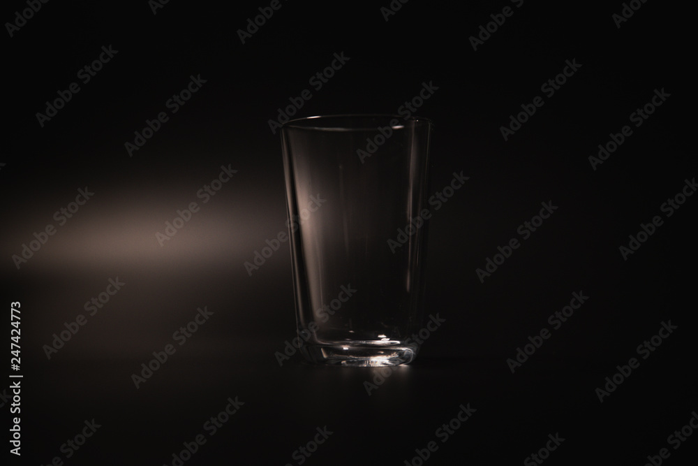 On a black background in a glass of water poured