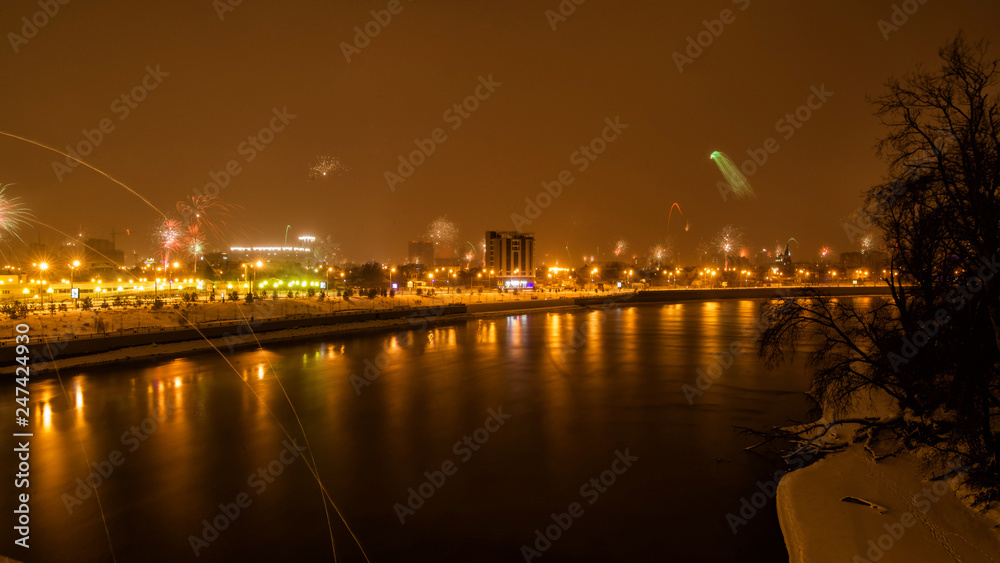 panorama of fireworks over the night city reflected in the river panorama of fireworks over the night city reflected in the river