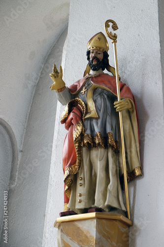 Statue of Saint in the Saint Lawrence church in Kleinostheim, Germany photo