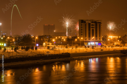 panorama of fireworks in honor of the new year in Krasnodar near the river Kuban
