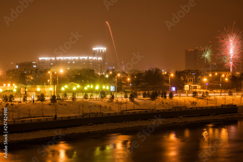 panorama of fireworks in honor of the new year near the river Kuban