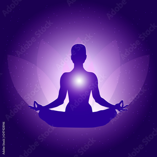 Silhouette of Person in yoga lotus asana on dark blue purple background with lotus flower and light