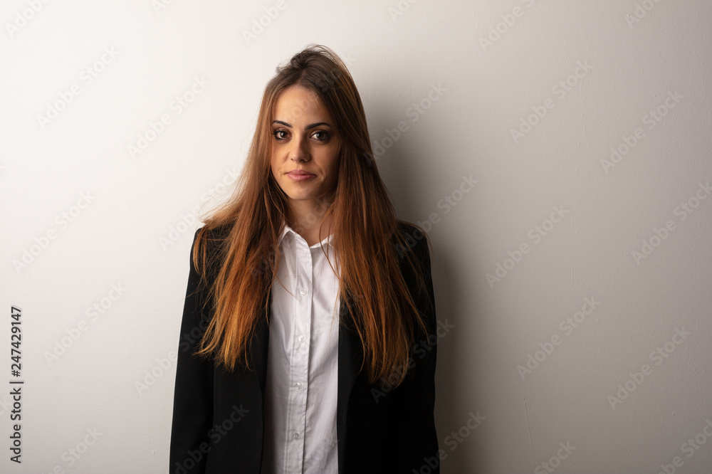 Young business woman wearing santa hat celebrating christmas day