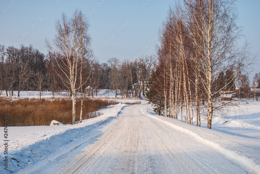 Winter snowy country road in the village Winter snowy country road in the village