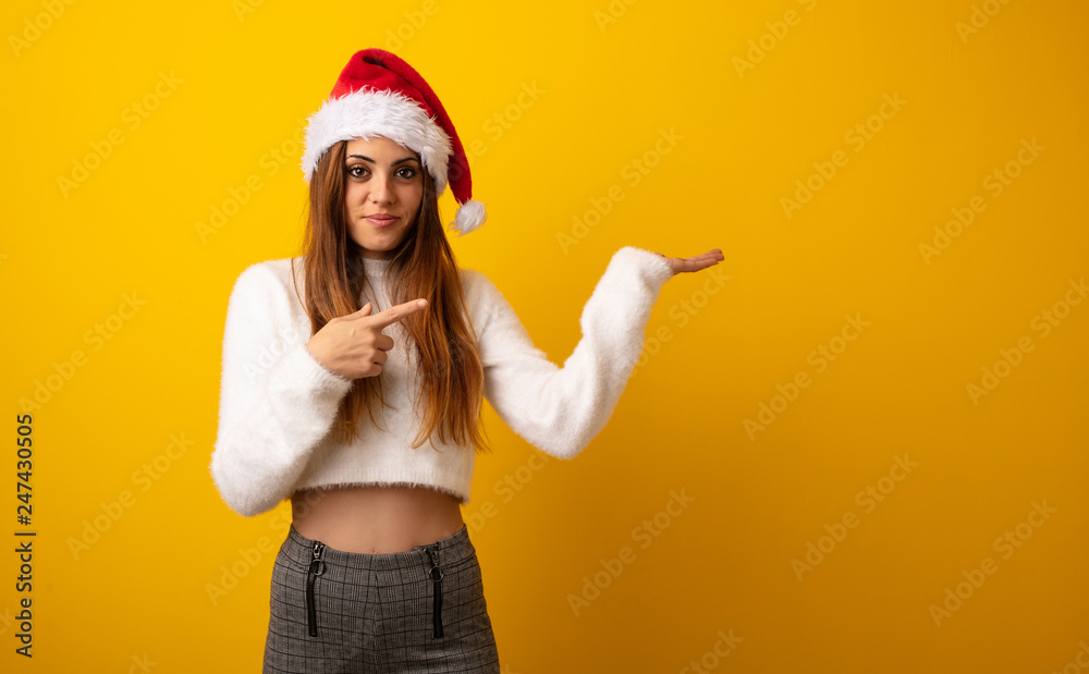 Young pretty woman holding gift holding something with hand Young pretty woman holding gift holding something with hand