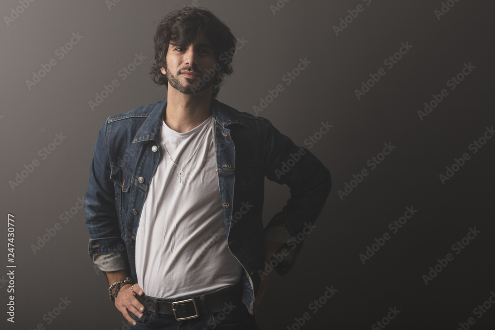 Fototapeta premium Young caucasian rock an roll man expressing emotions