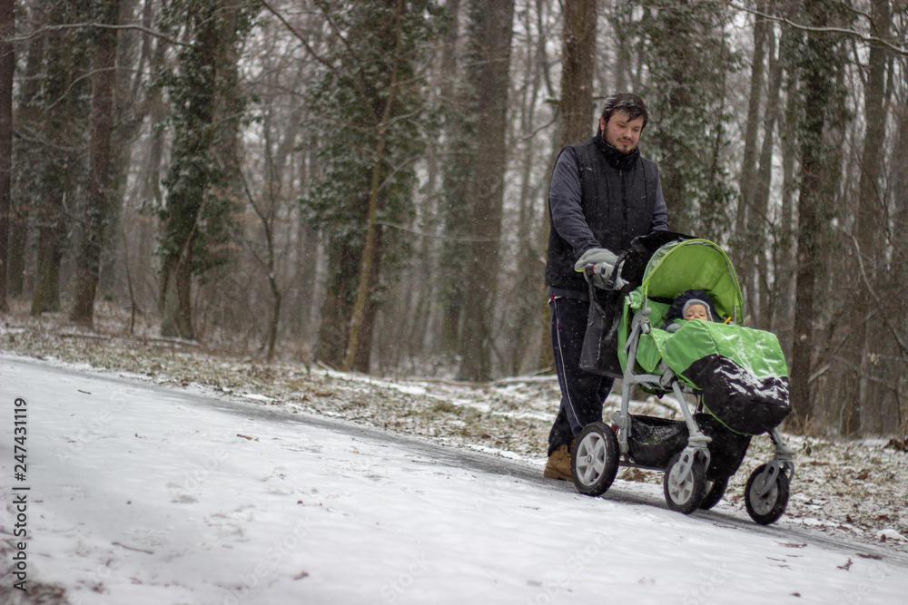 father with baby in stroller