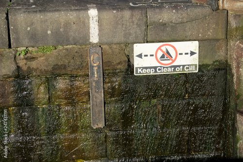 Keep clear of cill sign at water dam way for passing of canal boat photo