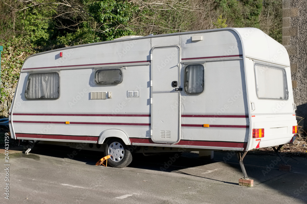 Old caravan dumped broken at roadside by travellers gypsies environmental pollution