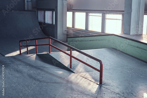 Skate railing for grinding at the empty indoors skatepark