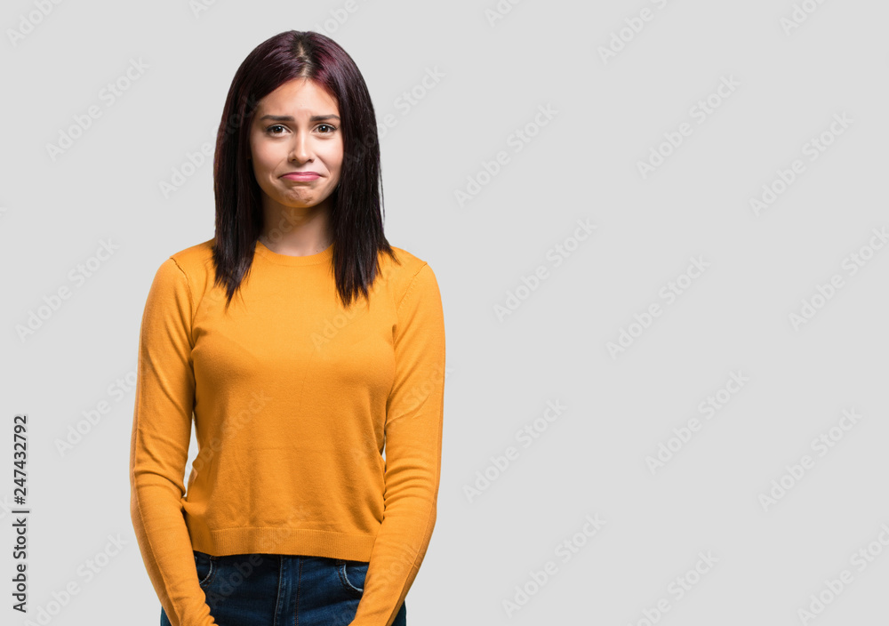 Young pretty woman doubting and confused, thinking of an idea or worried about something Young pretty woman doubting and confused, thinking of an idea or worried about something