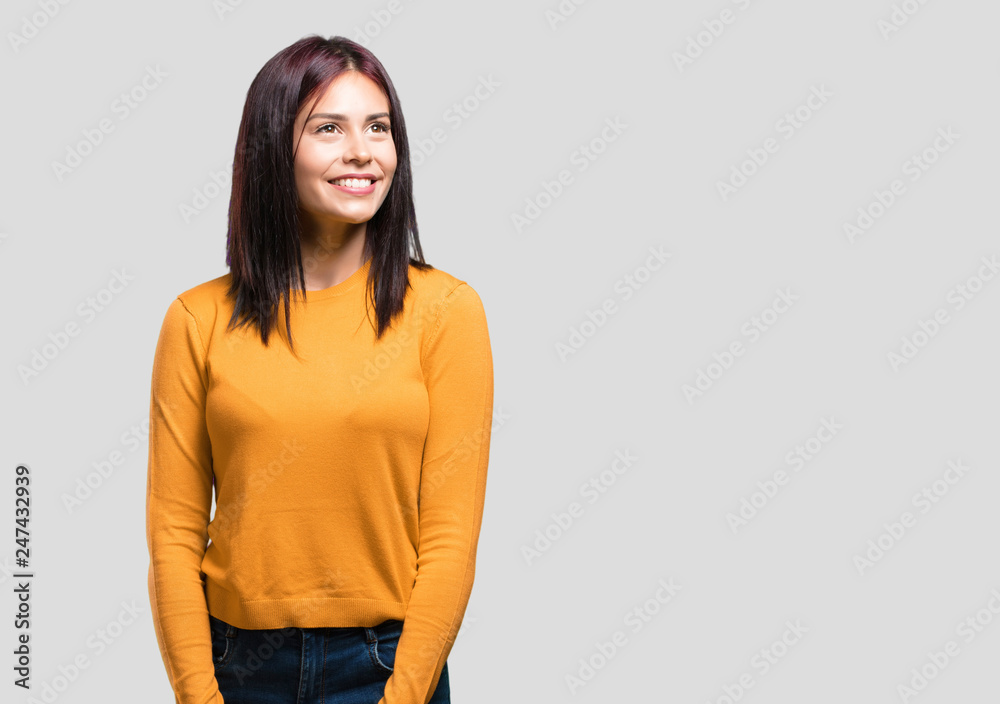 Young pretty woman looking up, thinking of something fun and having an idea, concept of imagination, happy and excited Young pretty woman looking up, thinking of something fun and having an idea, concept of imagination, happy and excited
