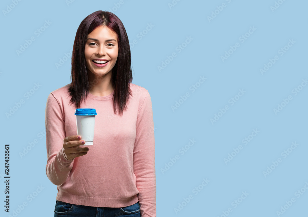 Young pretty woman closeup of someone holding a coffee to go, concept of motivation, energy and vitality Young pretty woman closeup of someone holding a coffee to go, concept of motivation, energy and vitality