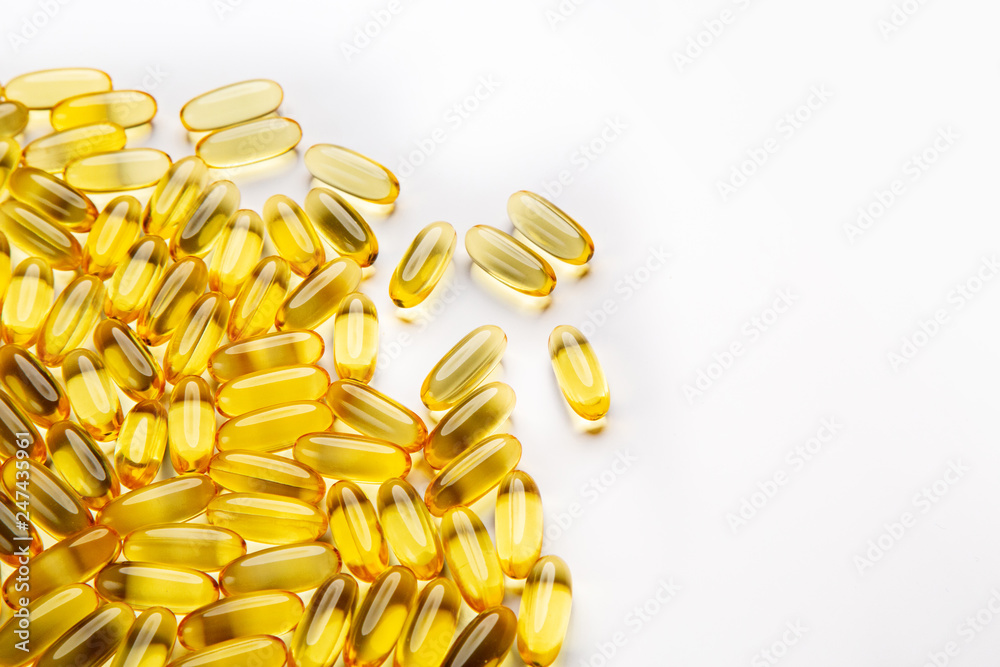 Omega-3 fish fat oil capsules on a white background. Omega-3 fish fat oil capsules on a white background.