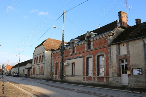 Village, small town in northeastern France. Champagne, Marne, Grand Est. Warm, calm, pleasant, spring day. Traditional, old, characteristic, buildings. Typical french street. Local, rural atmosphere.