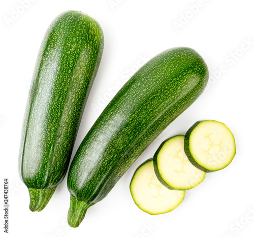 Ripe zucchini and sliced slices on a white. The form of the top. photo