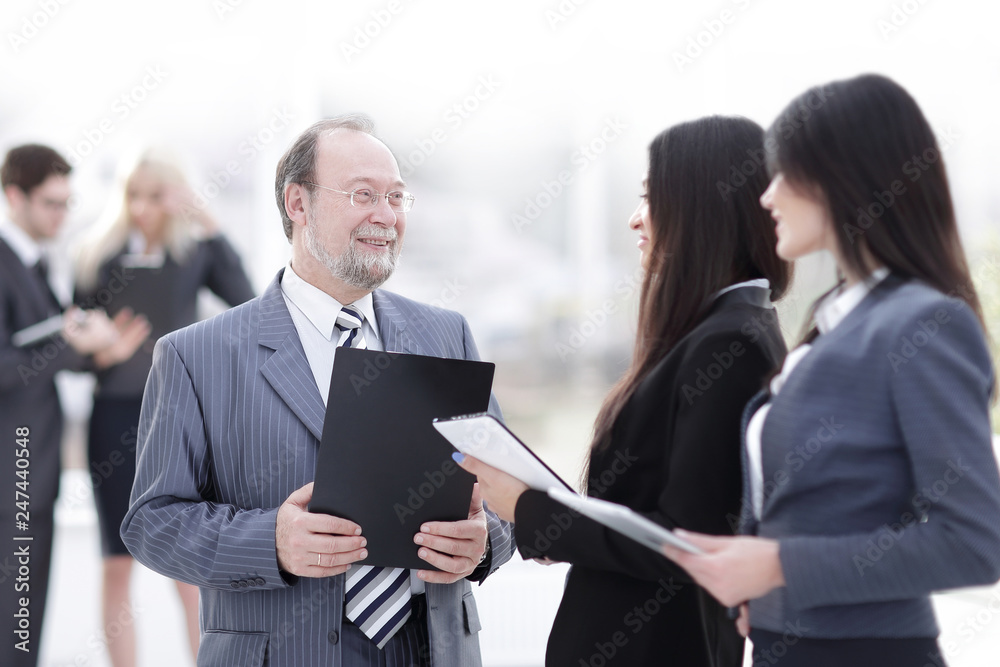 close up.group of business people standing in lobby of office. close up.group of business people standing in lobby of office.