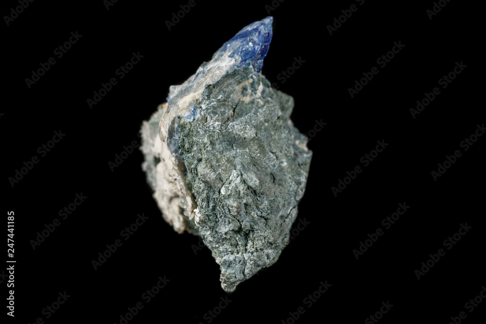 Macro mineral stone Bentorite on a black background