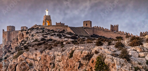 View of ancient Jayran walls atop mount San Cristobal in Almeria, Andalusia, Spain, at dusk.