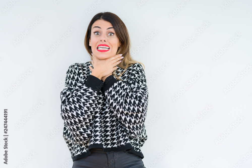Young woman wearing casual sweater over isolated background shouting and suffocate because painful strangle. Health problem. Asphyxiate and suicide concept. Young woman wearing casual sweater over isolated background shouting and suffocate because painful strangle. Health problem. Asphyxiate and suicide concept.