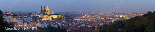 Prague - The panorama of the Town with the Castle and St. Vitus cathedral at dusk.