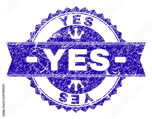 YES rosette seal watermark with distress texture. Designed with round rosette, ribbon and small crowns. Blue vector rubber watermark of YES label with retro texture.