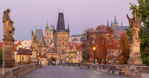 Prague - The Castle and Cathedral and st. Nicholas church from Charles Bridge in the morning dusk.