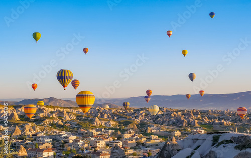 Colorful hot air balloons flying over rock landscape at Cappadocia Turkey © maribom
