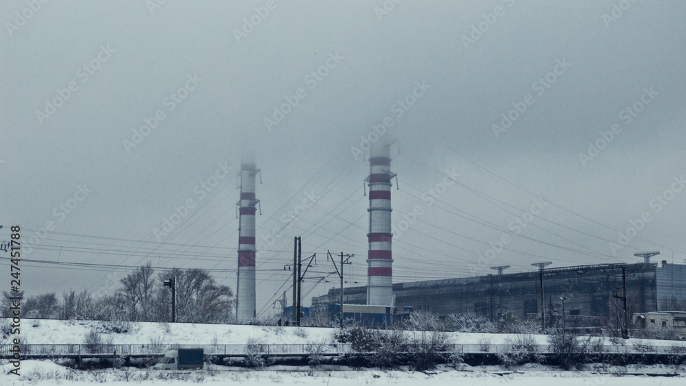 Idustrial zone, huge factory, producing co2, fog