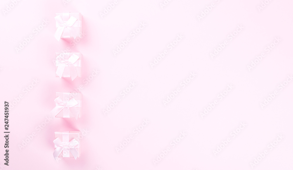 Gift box on pastel pink background.Holiday composition. Mother's day, Women's Day, Birthday feast concept. Flat lay, top view, copy space. Gift box on pastel pink background.Holiday composition. Mother's day, Women's Day, Birthday feast concept. Flat lay, top view, copy space.