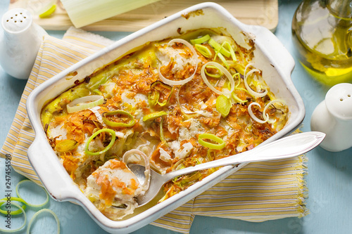 Oven dish gratin with cod fish, carrots and leeks photo
