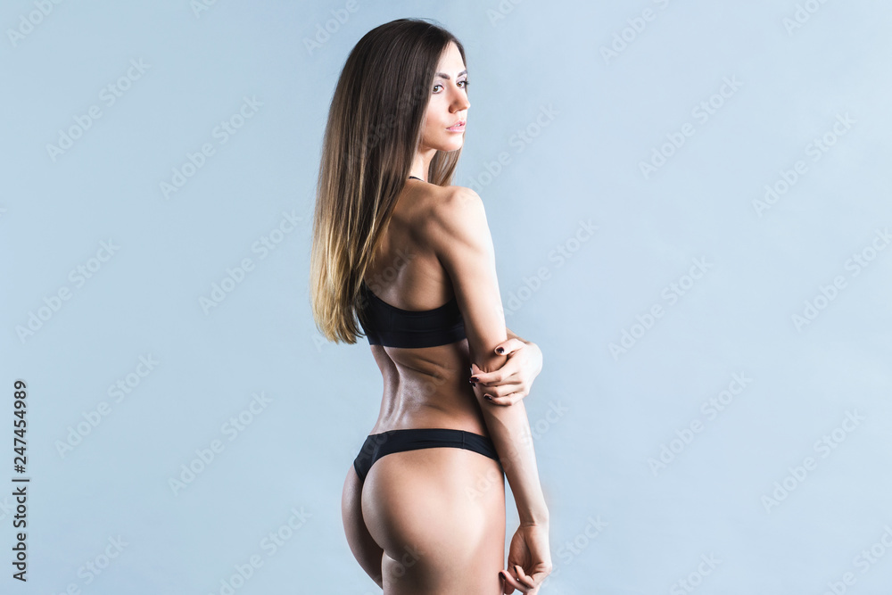 Perfect fitness body. Model with fit muscular and slim body in sportswear. Perfect fitness body. Model with fit muscular and slim body in sportswear.