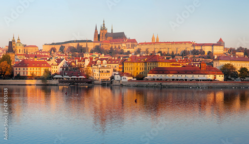 Prague - The Mala Strana, Castle and Cathedral from promenade over the Vltava river in the morning light.