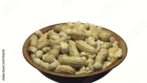 Peanuts. Mixed Peanuts in rotation. Snack closeup.   Peanuts in a bowl. Selective focus. Isolated on white. Studio shot. Healthy food concept.