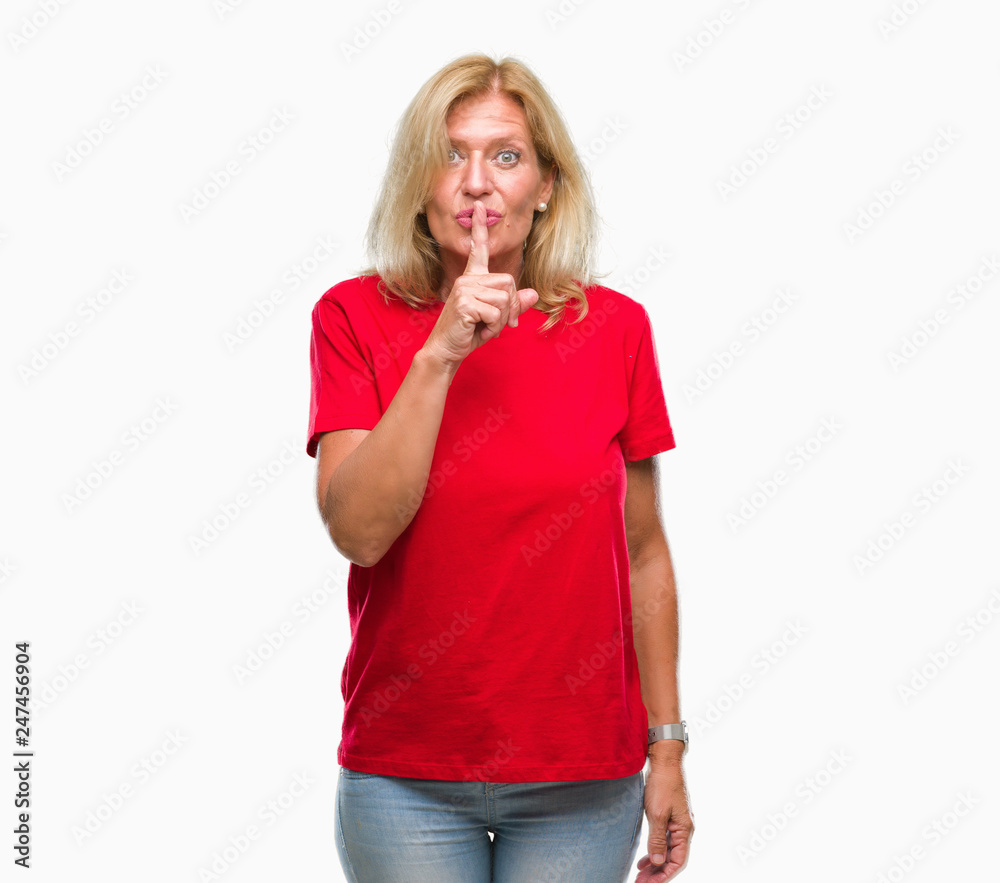 Middle age blonde woman over isolated background asking to be quiet with finger on lips. Silence and secret concept. Middle age blonde woman over isolated background asking to be quiet with finger on lips. Silence and secret concept.