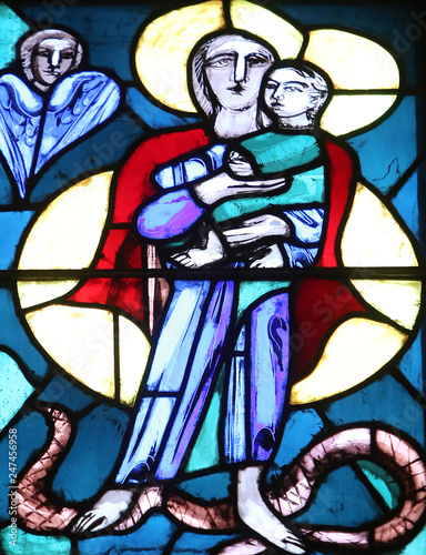 Madonna with Child Jesus, stained glass window in Basilica of St. Vitus in Ellwangen, Germany 
