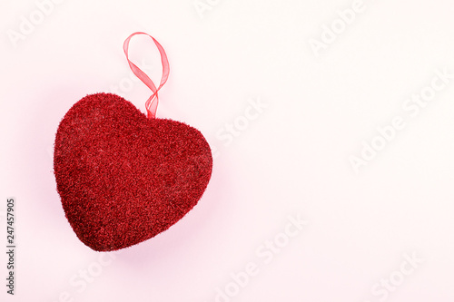 Valentines day composition on pastel pink background. Scenery red heart shape.Сoncept of holiday and love. Flat lay, top view,  copy space